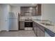 Well-equipped kitchen with stainless steel appliances and dark wood cabinets at 4127 Snowdrop St, North Port, FL 34288