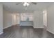 Spacious living room with wood-look floors and an open floor plan at 4127 Snowdrop St, North Port, FL 34288