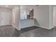 Open-concept living space with modern flooring and a view into the kitchen at 4127 Snowdrop St, North Port, FL 34288