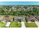 From above, a house is revealed next to a body of water and community at 420 Wabash Ter, Port Charlotte, FL 33954