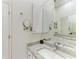 Clean bathroom featuring granite countertops, recessed lights and an expansive mirror at 420 Wabash Ter, Port Charlotte, FL 33954