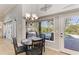 Bright breakfast nook with an elegant chandelier and a view of the lanai and pool area at 420 Wabash Ter, Port Charlotte, FL 33954