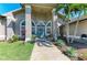 Charming home entrance with a beautiful front door, a manicured lawn, and lush landscaping at 420 Wabash Ter, Port Charlotte, FL 33954