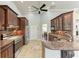 An open kitchen offers stainless steel appliances, sleek countertops, and plenty of cabinet space for storage at 420 Wabash Ter, Port Charlotte, FL 33954