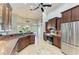 This spacious kitchen is complete with granite counters, stainless appliances, and an abundance of cabinets for storage at 420 Wabash Ter, Port Charlotte, FL 33954