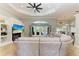 Spacious living room with a sectional sofa, built-in shelving, and views of the dining room at 420 Wabash Ter, Port Charlotte, FL 33954