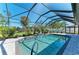 Sparkling blue pool in a screened enclosure, providing a private oasis for relaxation and recreation at 420 Wabash Ter, Port Charlotte, FL 33954