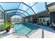Relax in this screened in pool that provides ample space for outdoor seating and entertainment at 420 Wabash Ter, Port Charlotte, FL 33954