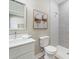 Bathroom featuring tile shower, a vanity and a well lit mirror at 4343 Killdeer Ter, North Port, FL 34288
