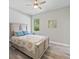 Comfortable bedroom featuring a ceiling fan and natural light from the window at 4343 Killdeer Ter, North Port, FL 34288