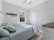 Comfortable bedroom with a ceiling fan, window view, and stylish whale decor at 4343 Killdeer Ter, North Port, FL 34288