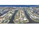 Neighborhood aerial showcasing canal-front homes with docks, in a prime waterfront community at 505 Via Cintia, Punta Gorda, FL 33950