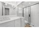 Modern bathroom with glass enclosed shower, marble countertops, and updated fixtures at 505 Via Cintia, Punta Gorda, FL 33950