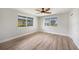 Bright bedroom with two windows, ceiling fan and wood-look flooring at 505 Via Cintia, Punta Gorda, FL 33950