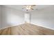 Bright bedroom with ceiling fan, light wood floors, and white trim at 505 Via Cintia, Punta Gorda, FL 33950
