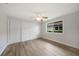 Bedroom with sliding closet doors, ceiling fan, and large window at 505 Via Cintia, Punta Gorda, FL 33950