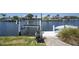 Dock and boat lift along the canal, providing easy access to the water at 505 Via Cintia, Punta Gorda, FL 33950