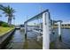 Canal view featuring a boat lift, providing convenient water access at 505 Via Cintia, Punta Gorda, FL 33950