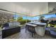 Covered patio with hot tub, views of waterway, and outdoor seating at 505 Via Cintia, Punta Gorda, FL 33950