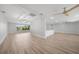 Open concept living space featuring new flooring, neutral walls, ceiling fans, and abundant natural light at 505 Via Cintia, Punta Gorda, FL 33950