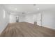 Spacious living room with ceiling fan, light wood floors, and white trim at 505 Via Cintia, Punta Gorda, FL 33950