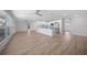 Open living space featuring new flooring, a center island, and stainless steel appliances at 505 Via Cintia, Punta Gorda, FL 33950
