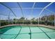 Sparkling pool surrounded by screened enclosure, brick patio and lush greenery at 505 Via Cintia, Punta Gorda, FL 33950