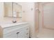 Bathroom featuring vanity with drawers, and shower at 5121 Chaves Cir, Port Charlotte, FL 33948