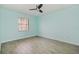 Bedroom featuring a window and wood look tile flooring at 5121 Chaves Cir, Port Charlotte, FL 33948