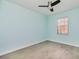 Bedroom featuring a window and wood look tile flooring at 5121 Chaves Cir, Port Charlotte, FL 33948