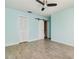 Bedroom featuring barn door and wood look tile flooring at 5121 Chaves Cir, Port Charlotte, FL 33948