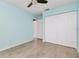 Bedroom featuring a closet and wood look tile flooring at 5121 Chaves Cir, Port Charlotte, FL 33948