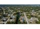 An aerial view of a neighborhood showcasing homes, streets, and a beautiful waterway at 7225 Sea Mist Dr, Port Charlotte, FL 33981