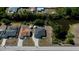 Aerial view of a property showcasing the home's layout, landscaping, and surrounding neighborhood at 7225 Sea Mist Dr, Port Charlotte, FL 33981
