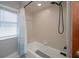 Bathroom with window, shower and ceramic tile walls at 7225 Sea Mist Dr, Port Charlotte, FL 33981