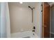 Bathroom with window, shower and ceramic tile walls at 7225 Sea Mist Dr, Port Charlotte, FL 33981