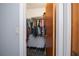 Walk-in closet with built-in shelving and ample space for storage at 7225 Sea Mist Dr, Port Charlotte, FL 33981