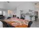 Open concept floor plan with dining area flowing into the kitchen with breakfast bar seating at 7225 Sea Mist Dr, Port Charlotte, FL 33981
