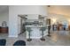 Open-concept kitchen featuring bar seating, stainless steel appliances, and a seamless connection to the living area at 7225 Sea Mist Dr, Port Charlotte, FL 33981
