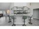 Spacious open kitchen boasts an island with bar stool seating, connecting seamlessly to the living areas at 7225 Sea Mist Dr, Port Charlotte, FL 33981