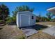 Durable outdoor storage shed with easy access, blending functionality with the surrounding landscape at 7225 Sea Mist Dr, Port Charlotte, FL 33981