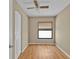 A secondary bedroom with neutral paint, ceiling fan, and window with blinds at 8172 Trionfo Ave, North Port, FL 34287