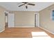 Bedroom featuring neutral walls, wood-look floors, and doors leading to other rooms at 8172 Trionfo Ave, North Port, FL 34287