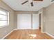 Bedroom featuring a ceiling fan, double closet, and neutral wall color at 8172 Trionfo Ave, North Port, FL 34287