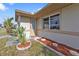 A charming front entrance with decorative landscaping and a cozy welcome mat at 8172 Trionfo Ave, North Port, FL 34287