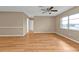 Bright living area with wood floors, neutral paint, and a window for natural light at 8172 Trionfo Ave, North Port, FL 34287