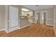 View of the living room, dining area, and kitchen offering an open floor plan and neutral paint at 8172 Trionfo Ave, North Port, FL 34287