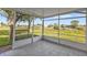 Enclosed patio with light gray tile flooring and views of backyard and neighborhood at 8172 Trionfo Ave, North Port, FL 34287