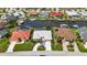 Home with a screened-in pool, boat dock, and well-manicured lawn in a waterfront neighborhood at 859 Napoli Ln, Punta Gorda, FL 33950