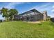 Expansive backyard with a screened-in pool area, perfect for outdoor enjoyment at 859 Napoli Ln, Punta Gorda, FL 33950